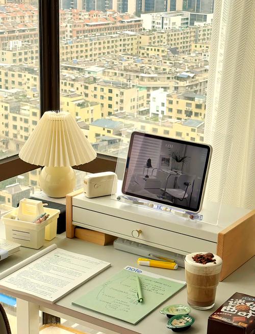 sunlit home office desk with coffee and laptop