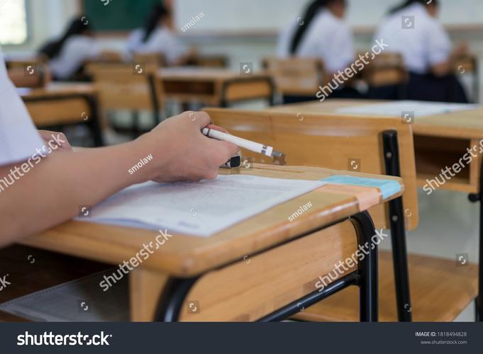 students taking ACT computer test in modern exam center with monitors
