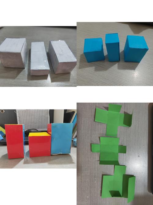 小学生用空快递盒拼搭做数学实验照片