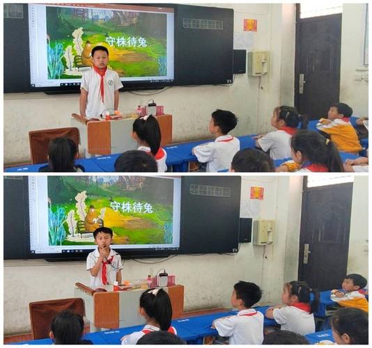 小学课堂上孩子举着寓言绘本表达自己想法的实拍