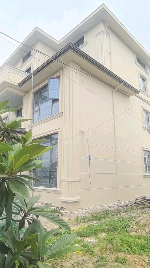 联排别墅米黄色真石漆外墙完工实景