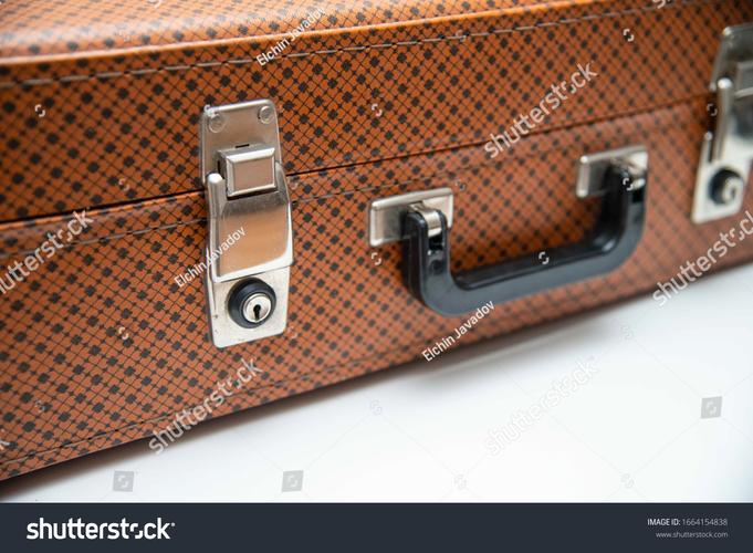 vintage leather trunk brass locks close-up