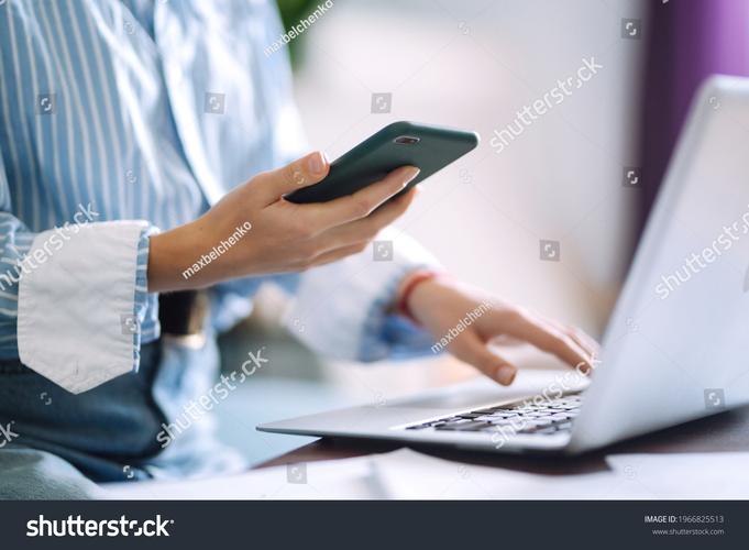 person working from home but distracted by phone and TV
