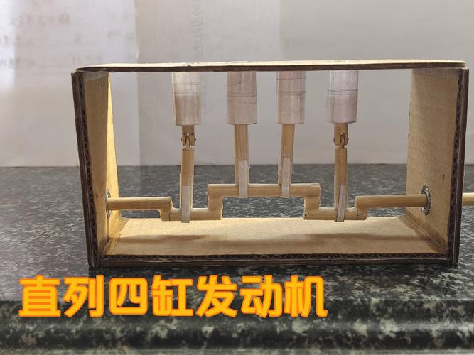 亲子在汽车工厂儿童互动展示区触摸发动机模型