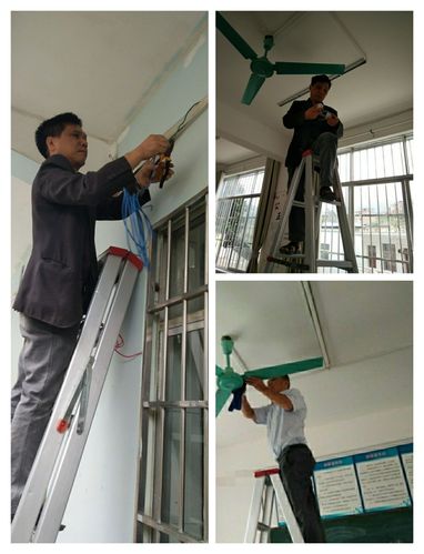 中学校长在教室走廊踮脚更换坏灯管的随手拍