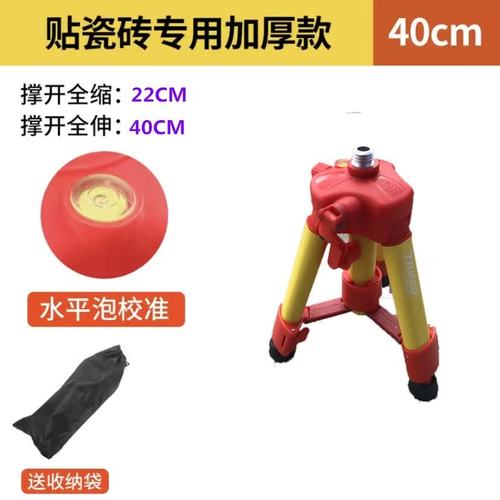 装修工人使用三脚架固定激光水平仪打线