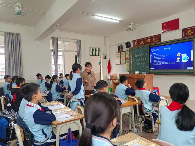中学教室后排学生举手提问场景